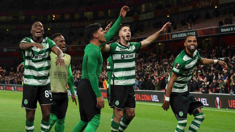Sporting players celebrate after the penalty shootout during the Europa League round of 16, second leg, soccer match between Arsenal and Sporting CP at the Emirates stadium in London, Thursday, March 16, 2023. (AP Photo/Ian Walton)