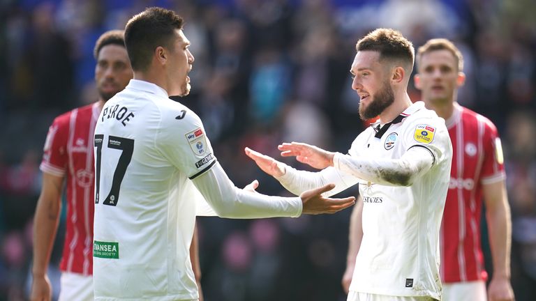 Swansea's Joel Piroe (left) and Matt Grimes celebrate after securing a vital three points
