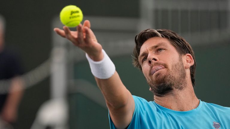 Cameron Norrie, of Britain, serves to Andrey Rublev, of Russia, at the BNP Paribas Open tennis tournament Tuesday, March 14, 2023, in Indian Wells, Calif.