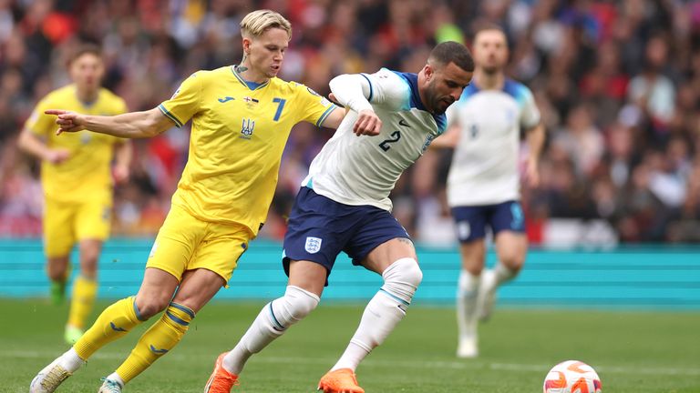 Ukraine's Mykhailo Mudryk, left, and England's Kyle Walker vie for the ball during the Euro 2024 group C qualifying soccer match between England and Ukraine at Wembley Stadium in London, Sunday, March 26, 2023.(AP Photo/Ian Walton)