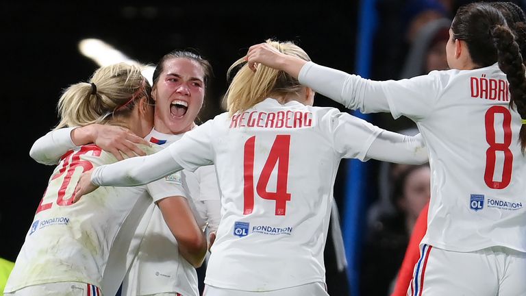 Vanessa Gilles of Olympique Lyonnais celebrates with team mates after scoring vs Chelsea