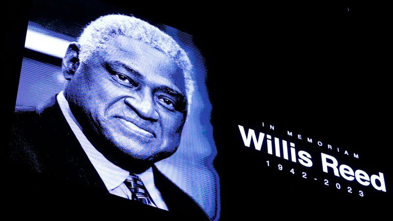 The Brooklyn Nets have a moment of silence for former New York Knick center Willis Reed before an NBA basketball game between the Brooklyn Nets and Cleveland Cavaliers, Tuesday, March 21, 2023, in New York. (AP Photo/Noah K. Murray)