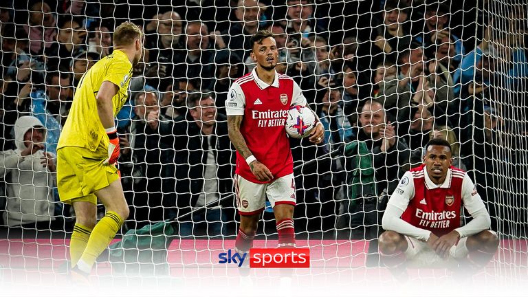 Arsenal&#39;s Ben White, centre, retrieves the ball after Manchester City&#39;s scored their third goal during the English Premier League soccer match between Manchester City and Arsenal at Etihad stadium