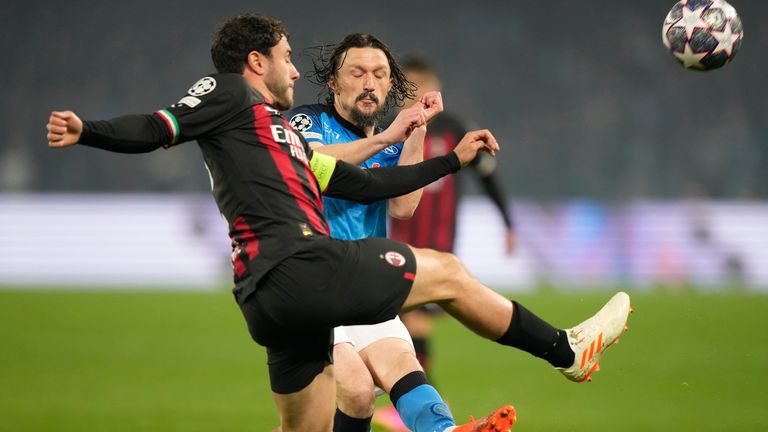 AC Milan's Davide Calabria, left, fights for the ball with Napoli's Mario Rui