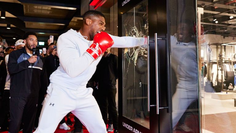 Anthony Joshua opens a new Under Armour store in London with a signature punch. 
