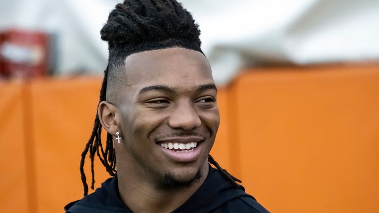 Texas running back Bijan Robinson, looks on from the sidelines as he watches other players workout for NFL scouts during Texas Pro Day, on Thursday, March 9, 2023, in Austin, Texas. (AP Photo/Rodolfo Gonzalez)