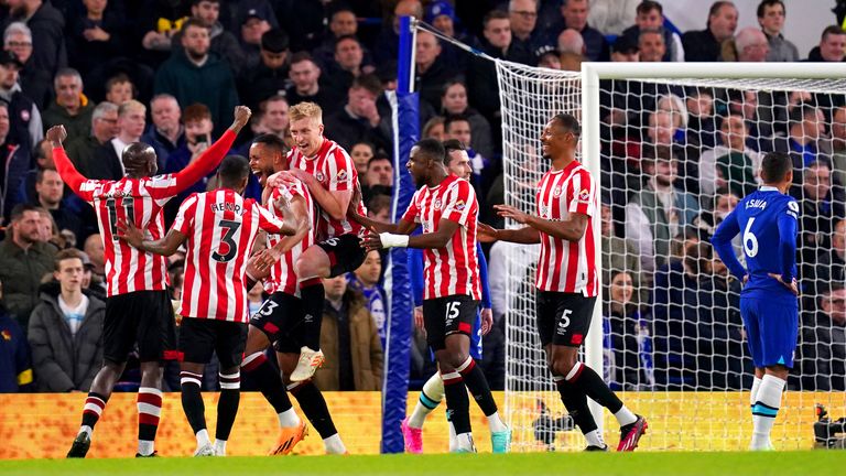 Brentford players celebrate after Chelsea's Cesar Azpilicueta (not pictured) scores an own goal