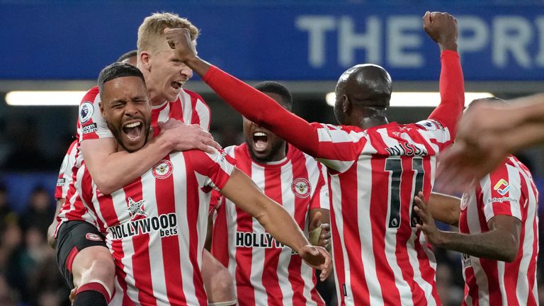 Brentford players celebrate after Chelsea's Cesar Azpilicueta scored an own goal