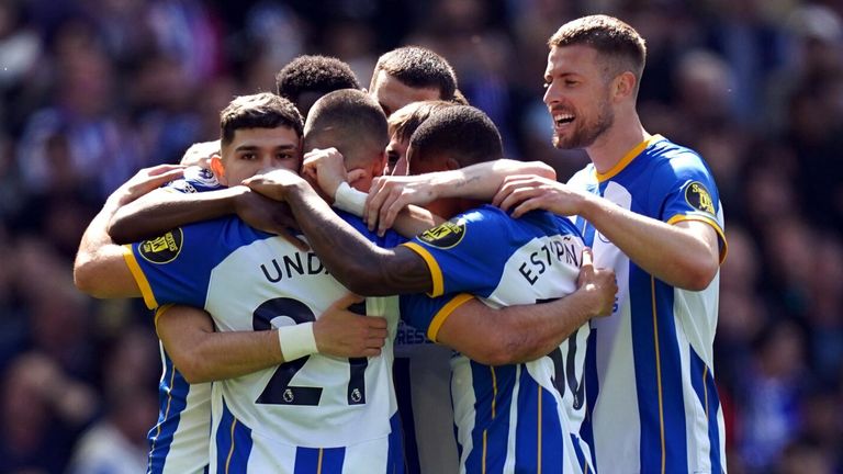 Deniz Undav is mobbed by his team-mates after giving Brighton an early lead against Wolves