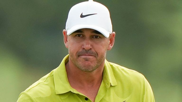 Brooks Koepka waves after his putt on the 18th hole during the first round of the Masters golf tournament at Augusta National Golf Club on Thursday, April 6, 2023, in Augusta, Ga. (AP Photo/Charlie Riedel)