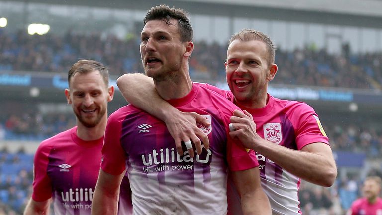 Matthew Pearson celebrates with team-mates after Huddersfield take a 2-0 lead at Cardiff via an own goal