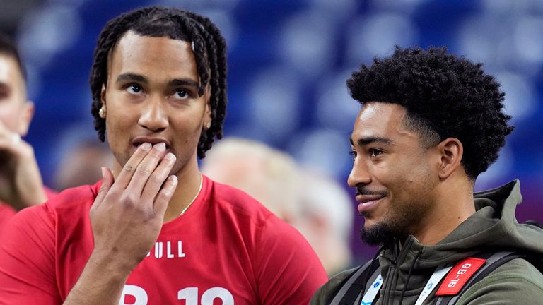 FILE - Ohio State quarterback CJ Stroud, left, talks to Alabama quarterback Bryce Young at the NFL football scouting combine in Indianapolis, Saturday, March 4, 2023. The Carolina Panthers have been on the clock since making a blockbuster trade last month to acquire the No. 1 overall pick in the NFL draft and get their choice of potential franchise quarterbacks. There is still no general consensus on which QB will go first. Stroud or Young? (AP Photo/Darron Cummings, File)