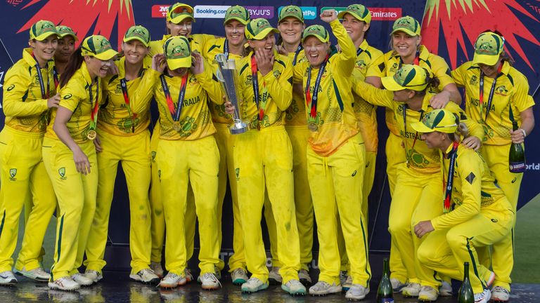 Australia players celebrate after winning the Women&#39;s T20 World Cup semi final cricket match against South Africa, in Cape Town, South Africa, Sunday Feb. 26, 2023. (AP Photo/Halden Krog)