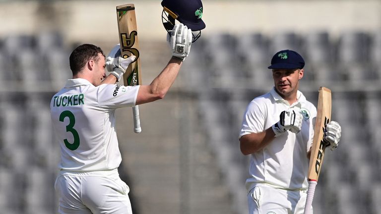Ireland's Lorcan Tucker (L) celebrates after scoring a century (100 runs) as his teammate Andy McBrine watches during the third day of the Test cricket match between Bangladesh and Ireland at the Sher-e-Bangla National Cricket Stadium in Dhaka on April 6, 2023. (Photo by Munir uz ZAMAN / AFP) (Photo by MUNIR UZ ZAMAN/AFP via Getty Images)
