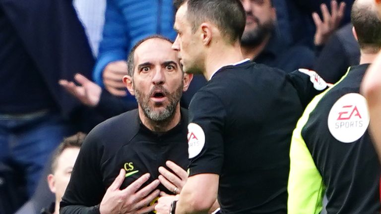 Cristian Stellini protests his innocence after referee Stuart Atwell shows him a red card