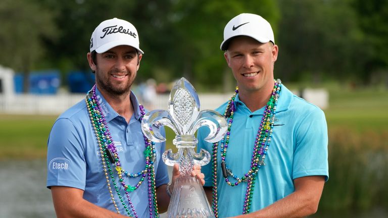 Davis Riley, left, and teammate Nick Hardy hold their trophy after winning the PGA Zurich Classic golf tournament at TPC Louisiana in Avondale, La., Sunday, April 23, 2023. (AP Photo/Gerald Herbert)