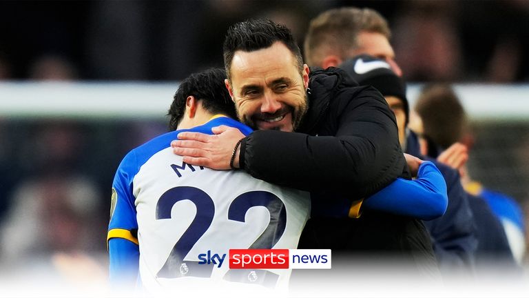 Brighton&#39;s head coach Roberto De Zerbi hugs Brighton&#39;s Kaoru Mitoma