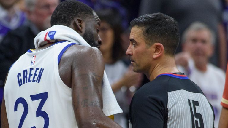 Golden State Warriors forward Draymond Green (23) talks to referee Zach Zarba (15) before he was ejected from Game 2 in the first round of the NBA basketball playoffs after stomping on the chest of Sacramento's Domantas Sabonis, Monday, April 17, 2023, in Sacramento, Calif.  (AP Photo/Randall Benton)