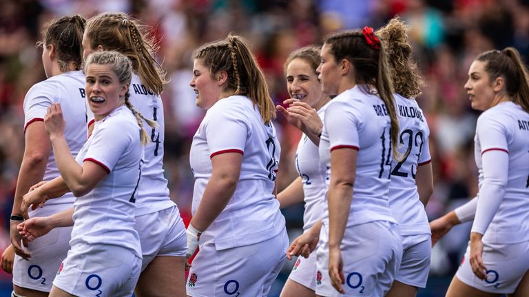 England's Maud Muir (centre) celebrates scoring her sides seventh try with team-mates against Wales