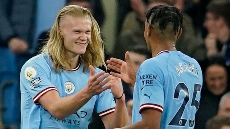 Manchester City's Erling Haaland celebrates with Manuel Akanji after scoring his side's fourth goal