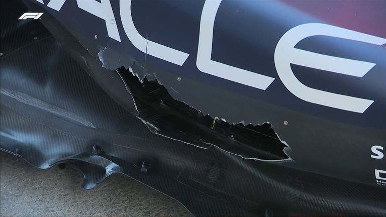 Max Verstappen's Red Bull was left with a big hole in its sidepod after contact with George Russell