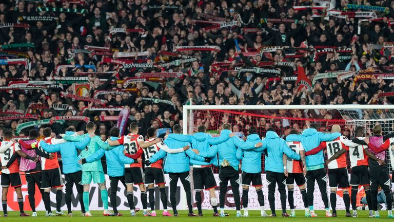 Feyenoord players celebrate at the end of the first leg