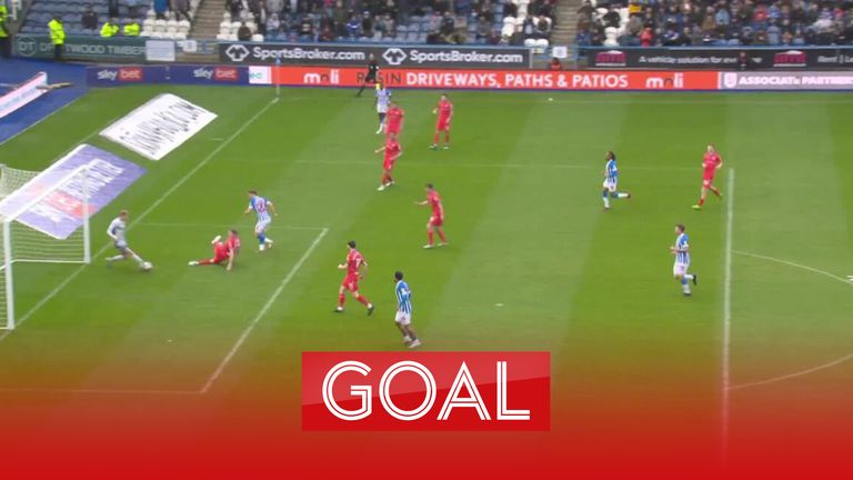 Jack Rudoni slots home a second goal for Huddersfield against Blackburn.