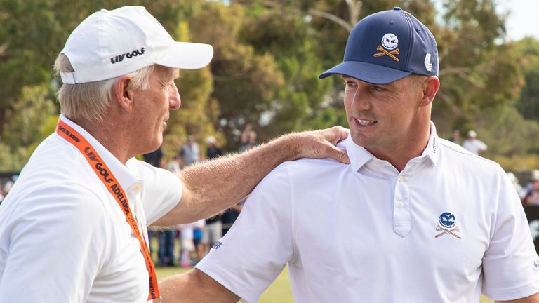 LIV Golf CEO, Greg Norman speaks to Captain Bryson DeChambeau of Crushers GC on the driving range during the first round of LIV Golf Adelaide at the Grange Golf Club on Friday, Apr. 21, 2023 in Adelaide, Australia. (Photo by Tertius Pickard/LIV Golf via AP)