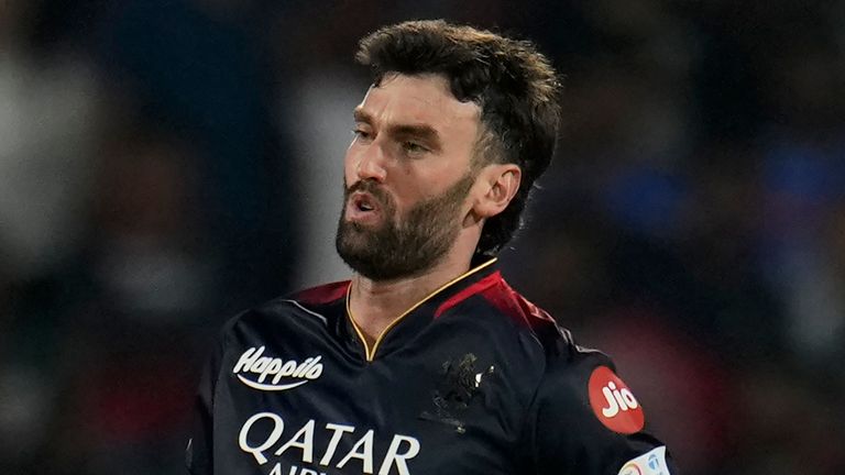 Royal Challengers Bangalore's Reece Topley reacts after bowling a delivery during the Indian Premier League cricket match between Royal Challengers Bangalore and Mumbai Indians in Bengaluru, India, Sunday, April 2, 2023. (AP Photo/Aijaz Rahi)
