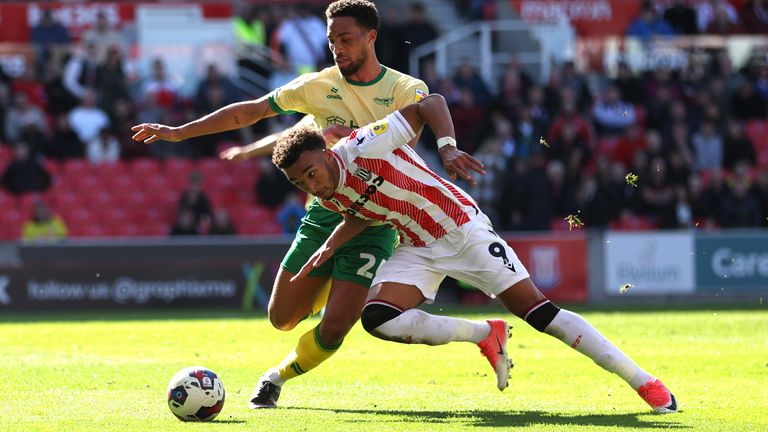 Jacob Brown of Stoke City is tackled by Zak Vyner of Bristol City