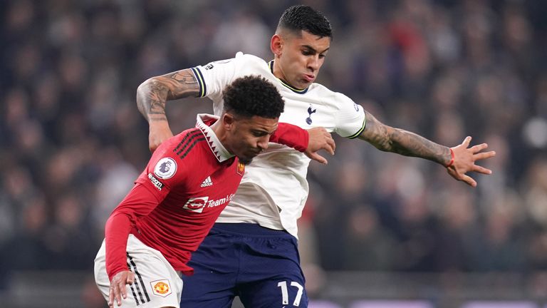 Jadon Sancho and Cristian Romero in action