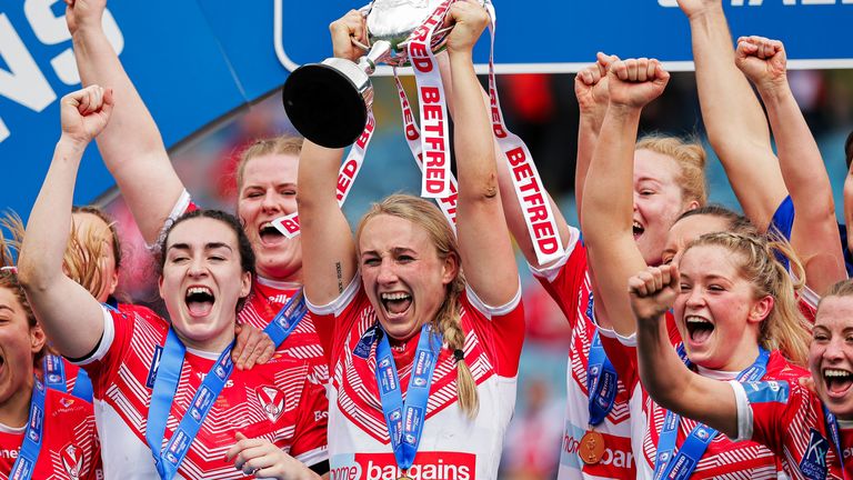 Picture by Alex Whitehead/SWpix.com - 07/05/2022 - Rugby League - Betfred Women’s Challenge Cup Final - Leeds Rhinos v St Helens - Elland Road, Leeds, England - St Helens captain Jodie Cunningham and team-mates celebrate with the Betfred Women’s Challenge Cup trophy.