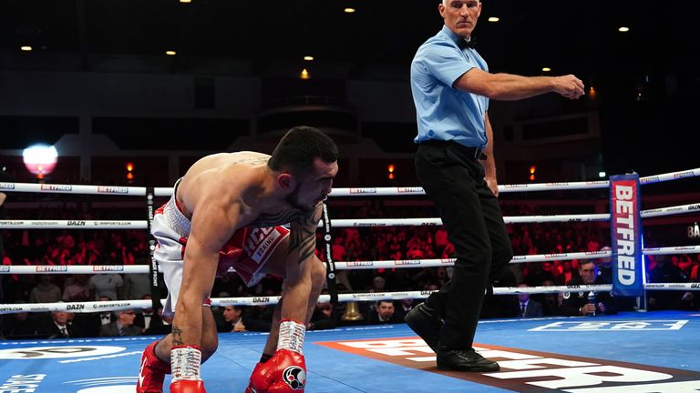 Shavkat Rakhimov tries to stand up after being sent to the canvas by Cordina 