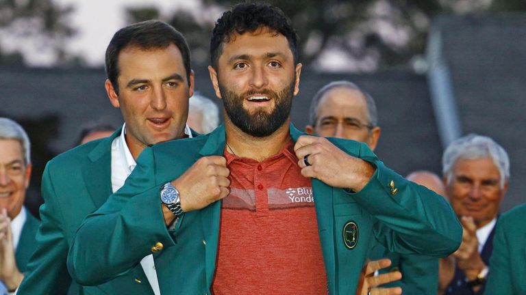 New Masters champion Jon Rahm (front) of Spain puts on his green jacket, given to him by last year's winner Scottie Scheffler of the United States, during a ceremony at Augusta National Golf Club in Augusta, Georgia, on April 9, 2023. (Kyodo via AP Images) ==Kyodo