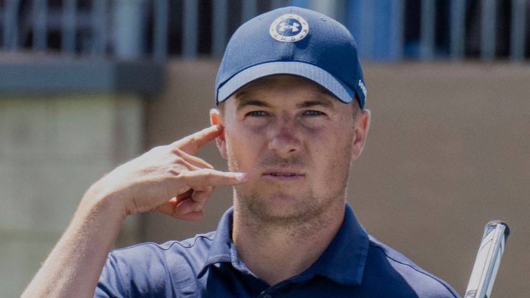 Jordan Spieth signals his caddy on No. 17 to call for a ruling by an Rules Official during the final round of the Valero Texas Open golf tournament in San Antonio, Sunday, April 3, 2022. (AP Photo/Michael Thomas)