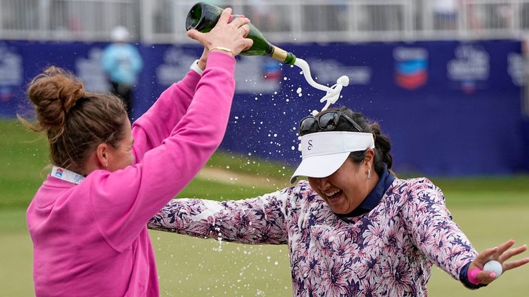 Lilia Vu, right, celebrates on the 18th green with Anne-Lise Bidou after winning in a playoff against Angel Yin in the Chevron Championship women's golf tournament at The Club at Carlton Woods on Sunday, April 23, 2023, in The Woodlands, Texas. (AP Photo/Eric Gay)