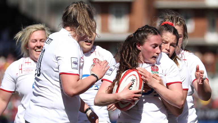 Lucy Packer celebrates with teamates after scoring England's first try vs Wales
