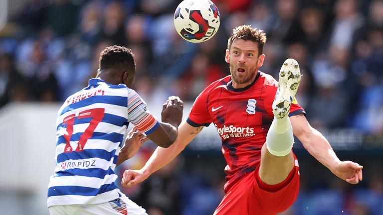 Lukas Jutkiewicz competes for the ball against Andy Yiadom