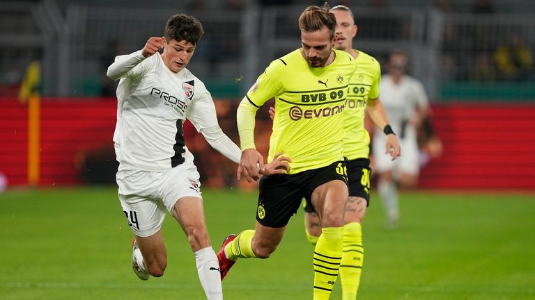 Ingolstadt's Merlin Rohl, left, challenges for the ball with Dortmund's Marin Pongracic during the German Soccer Cup match between Borussia Dortmund and FC Ingolstadt 04 in Dortmund, Germany, Tuesday, Oct. 26, 2021.