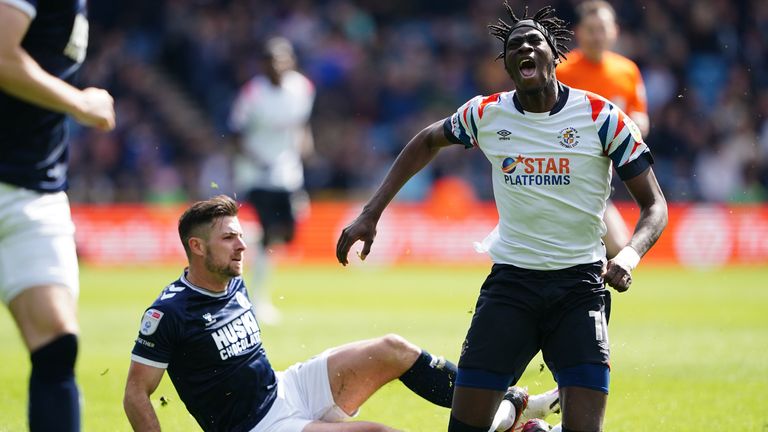 Millwall's Ryan Leonard tackles Luton's Elijah Adebayo