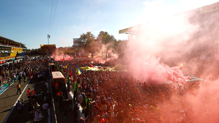 AUTODROMO NAZIONALE MONZA, ITALY - SEPTEMBER 11: Red smoke fills the air at the end of the race during the Italian GP at Autodromo Nazionale Monza on Sunday September 11, 2022 in Monza, Italy. (Photo by Andy Hone / LAT Images)