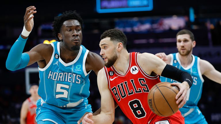 Chicago Bulls guard Zach LaVine (8) drives against Charlotte Hornets center Mark Williams (5) during the first half of an NBA basketball game in Charlotte, N.C., Friday, March 31, 2023. (AP Photo/Nell Redmond)


