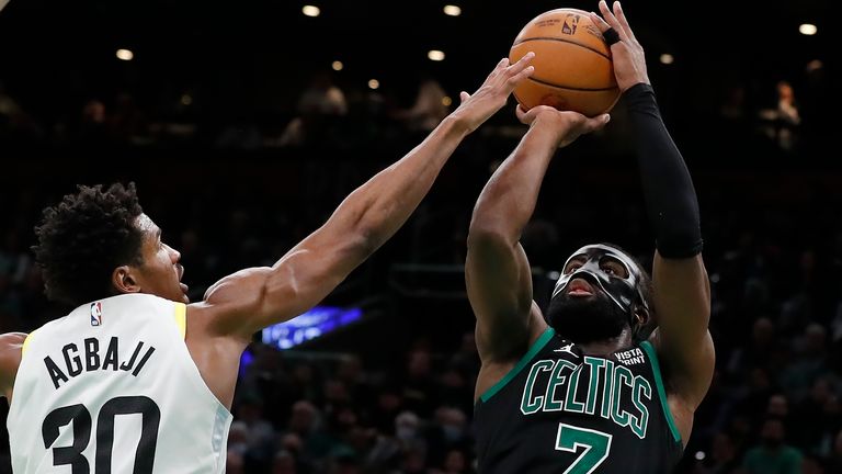 Boston Celtics&#39; Jaylen Brown (7) shoots against Utah Jazz&#39;s Ochai Agbaji (30) during the second half of an NBA basketball game, Friday, March 31, 2023, in Boston. (AP Photo/Michael Dwyer)



