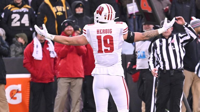 Herbig celebrates his sack of Iowa quarterback Spencer Petras 