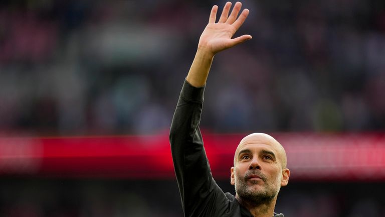 Manchester City's head coach Pep Guardiola waves at fans at the end of the FA Cup semi-final win