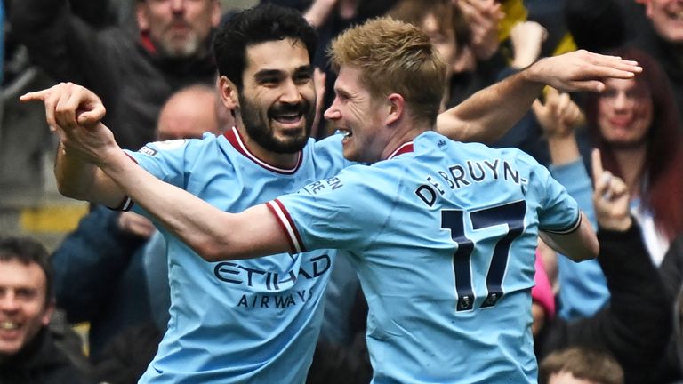 Ilkay Gundogan celebrates with Kevin De Bruyne after scoring Manchester City&#39;s third goal against Liverpool
