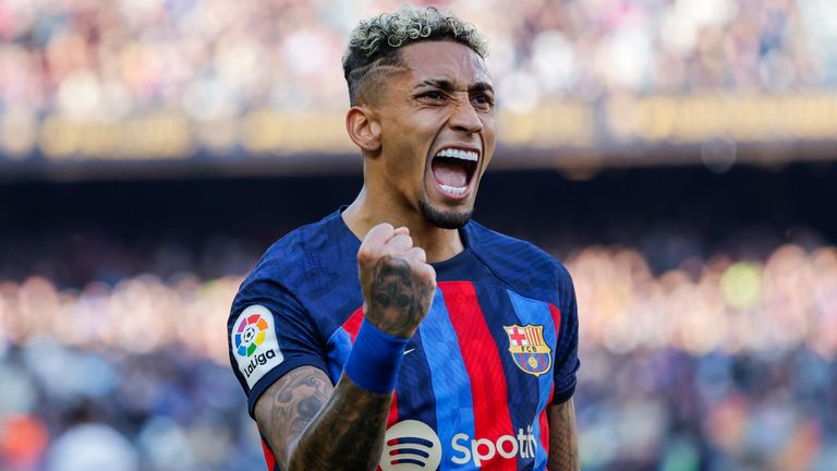 Barcelona's Raphinha celebrates scoring his side's opening goal during Spanish La Liga soccer match between Barcelona and Valencia at the Camp Nou stadium in Barcelona, Spain, Sunday, March 5, 2023. (AP Photo/Joan Monfort)