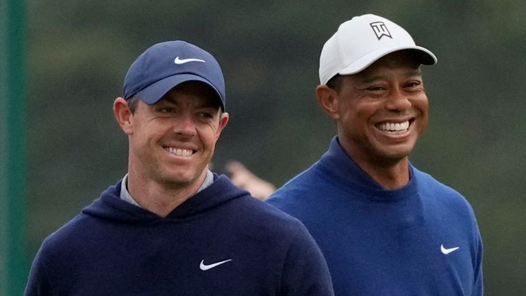 Rory McIlroy, of Northern Ireland, and Tiger Woods walk on the putting green during a practice for the Masters golf tournament at Augusta National Golf Club, Monday, April 3, 2023, in Augusta, Ga. (AP Photo/Jae C. Hong)