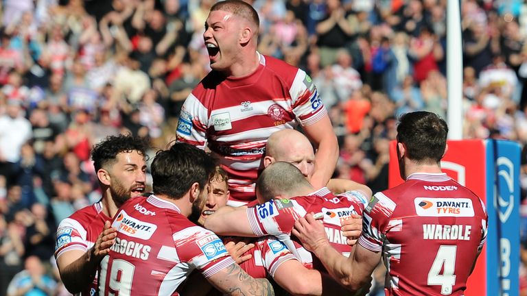 Wigan Warriors celebrate scoring their first try