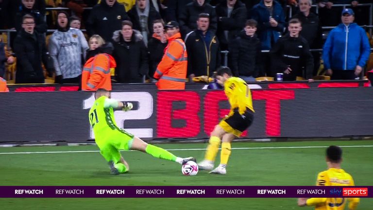 Crystal Palace keeper escapes with a yellow card for his challenge on Pedro Net.